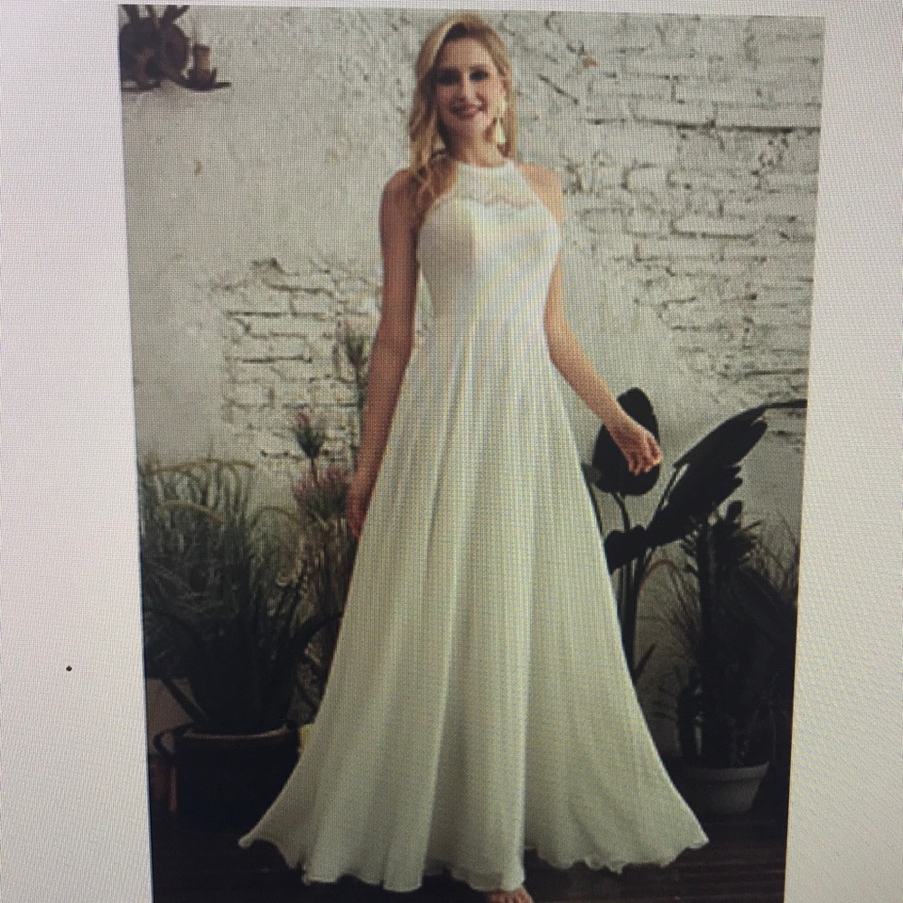 Brand new with tags ivory wedding dress. Bought from JJs house. Never worn